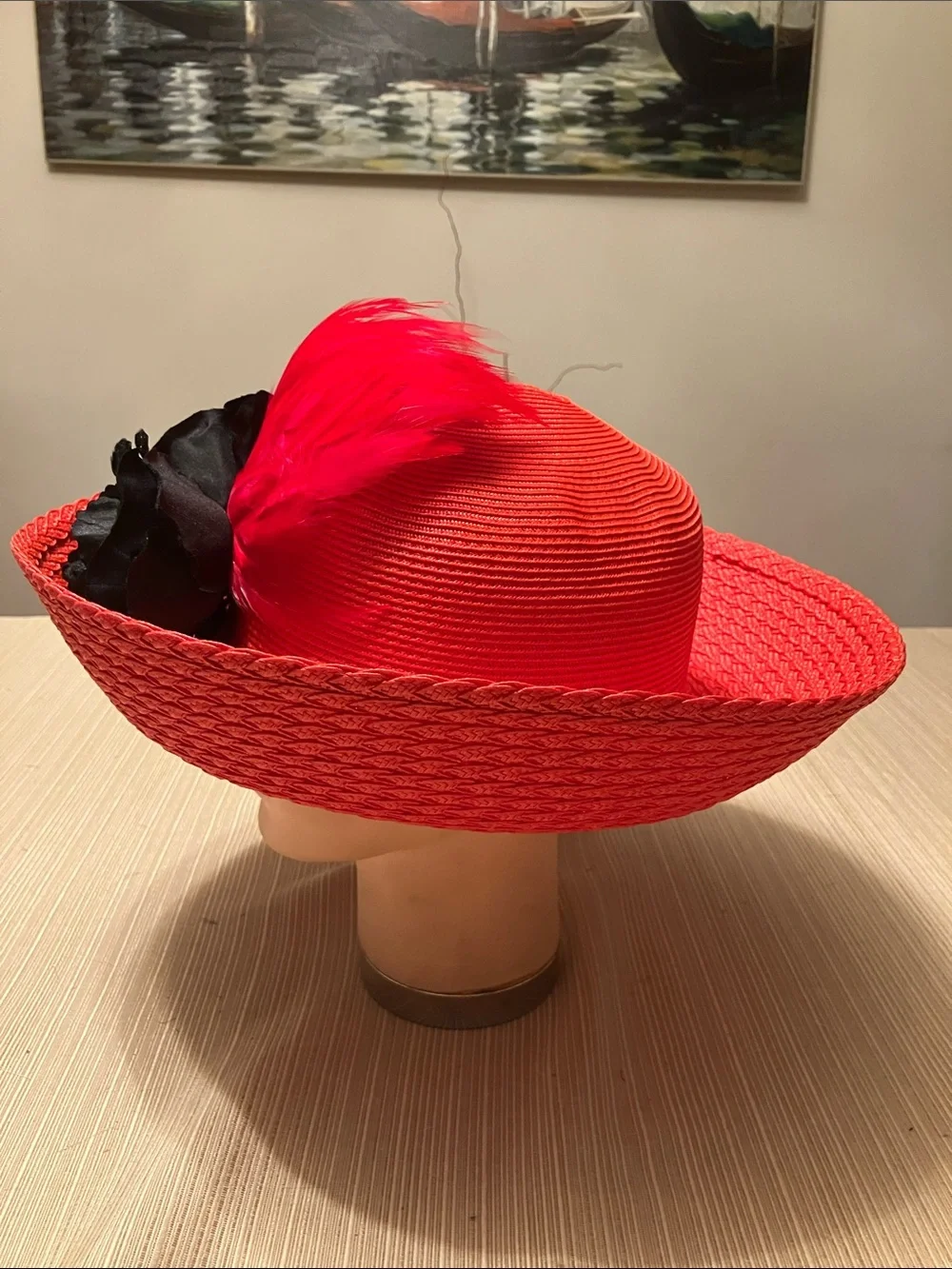 Red Straw Wide-Brimmed Hat with Black Velvet Floral and Red Feather Accents